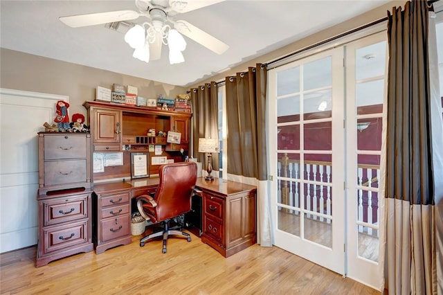 office with ceiling fan and light wood-type flooring