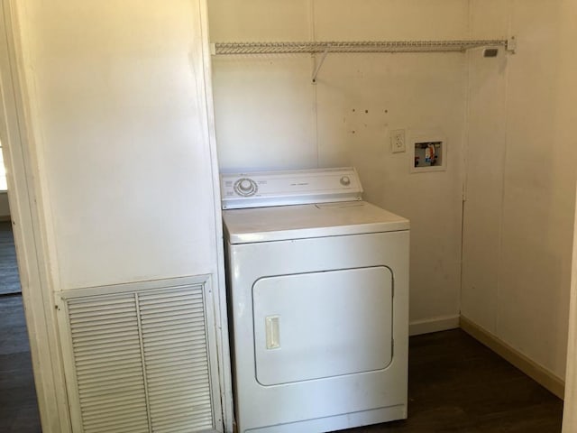 10186 NE 30th St, Okeechobee, FL 34974 - laundry room featuring washer / dryer, dark wood-style floors, and baseboards