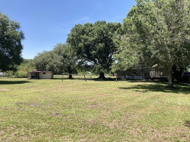 10186 NE 30th St, Okeechobee, FL 34974 - view of green lawn
