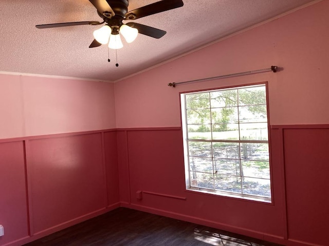 10186 NE 30th St, Okeechobee, FL 34974 - unfurnished room with a textured ceiling, dark wood-style floors, ornamental molding, a decorative wall, and a wainscoted wall