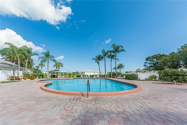 view of swimming pool featuring a patio area