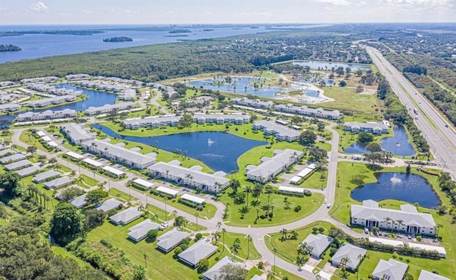 drone / aerial view featuring a water view