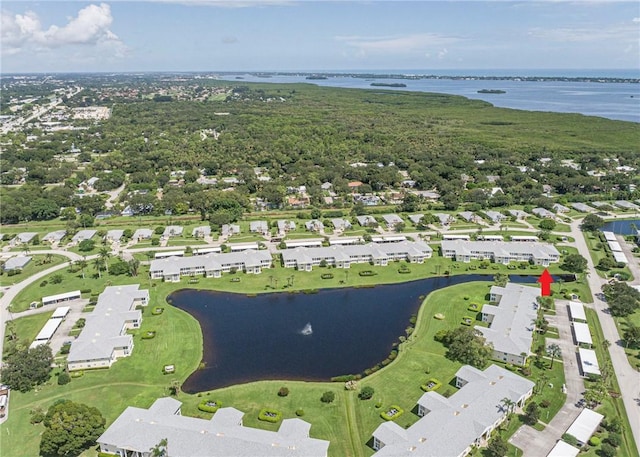 drone / aerial view featuring a water view and a residential view