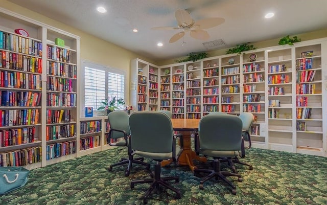 office space featuring carpet flooring, a textured ceiling, and ceiling fan