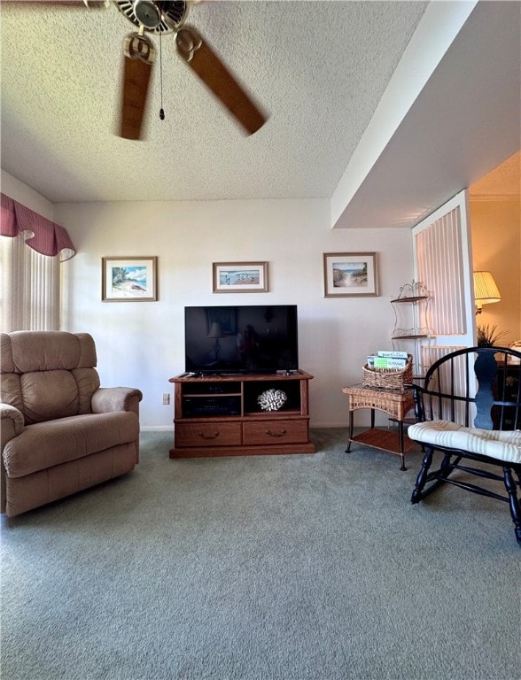 living room featuring a textured ceiling, ceiling fan, and carpet floors