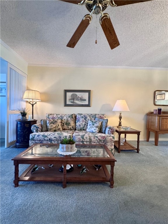 carpeted living room featuring a textured ceiling, ceiling fan, and ornamental molding