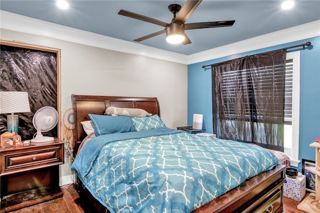 bedroom featuring ceiling fan, wood-type flooring, and crown molding