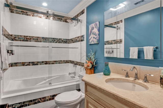 full bathroom with vanity, tiled shower / bath, and toilet