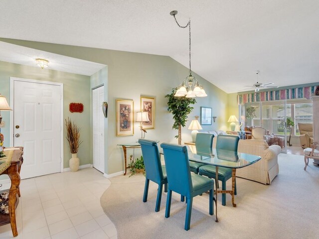 655 W Lake Jasmine Cir Unit 203, Vero Beach, FL 32962 - dining area with lofted ceiling, ceiling fan, a chandelier, baseboards, and light carpet