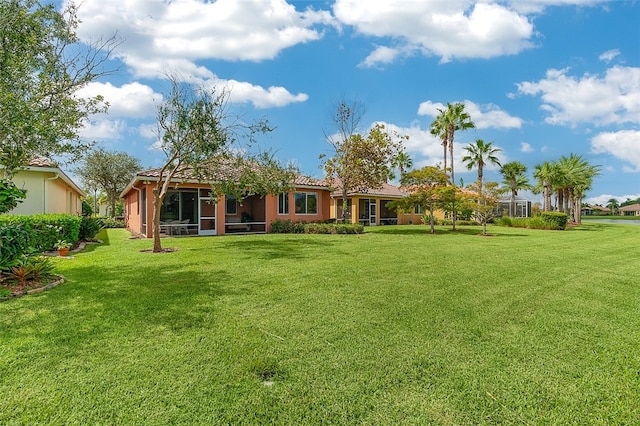 view of yard with a sunroom