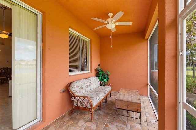 sunroom with ceiling fan