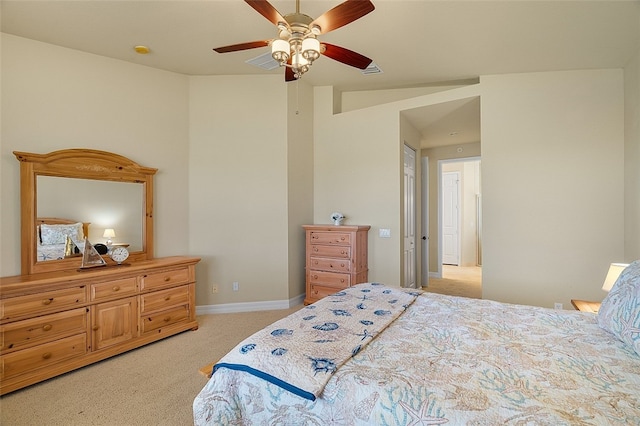 carpeted bedroom featuring ceiling fan and vaulted ceiling