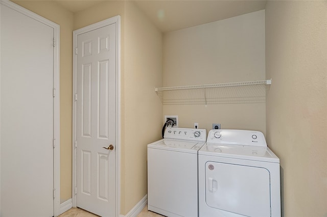 clothes washing area featuring washer and dryer