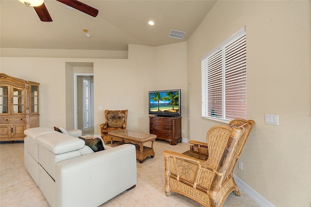 tiled living room featuring ceiling fan