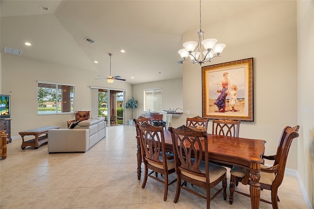 tiled dining area featuring ceiling fan with notable chandelier and high vaulted ceiling