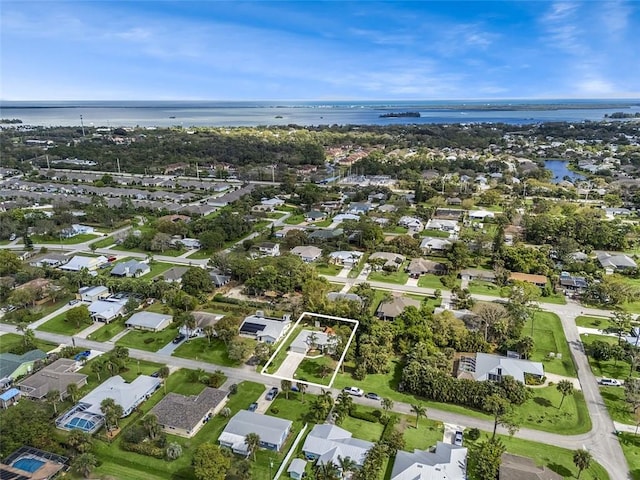 bird's eye view featuring a water view and a residential view