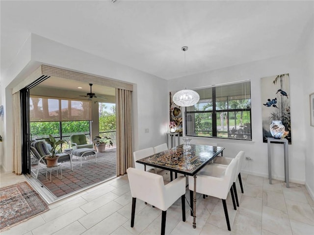 5205 Turtle Creek Cir, Vero Beach, FL 32967 - dining room featuring plenty of natural light, a chandelier, and a ceiling fan