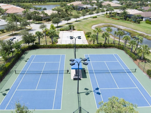 5205 Turtle Creek Cir, Vero Beach, FL 32967 - view of tennis court with a water view and a residential view