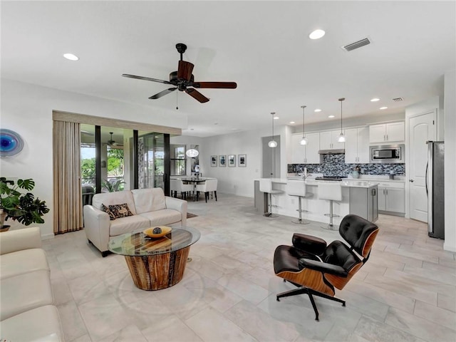5205 Turtle Creek Cir, Vero Beach, FL 32967 - living area featuring ceiling fan and recessed lighting