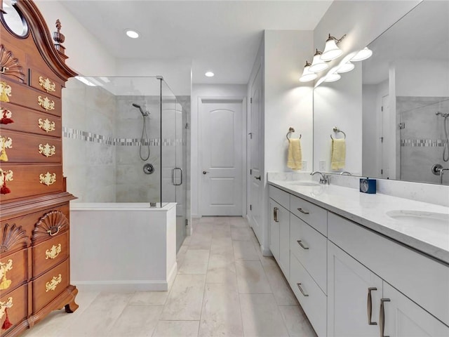 5205 Turtle Creek Cir, Vero Beach, FL 32967 - bathroom with double vanity, a shower stall, tile patterned flooring, and recessed lighting