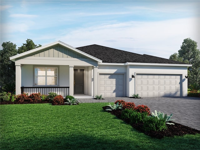 ranch-style home featuring a porch, a garage, and a front lawn