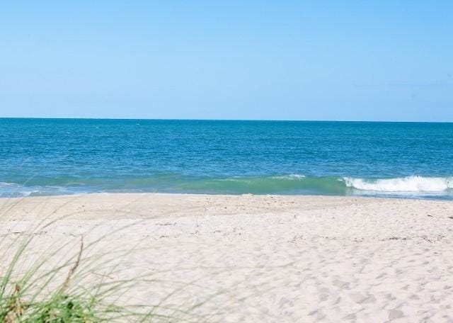 view of water feature with a beach view