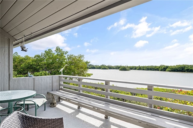 balcony featuring a water view