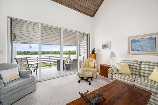 living room with wood ceiling, high vaulted ceiling, and carpet floors