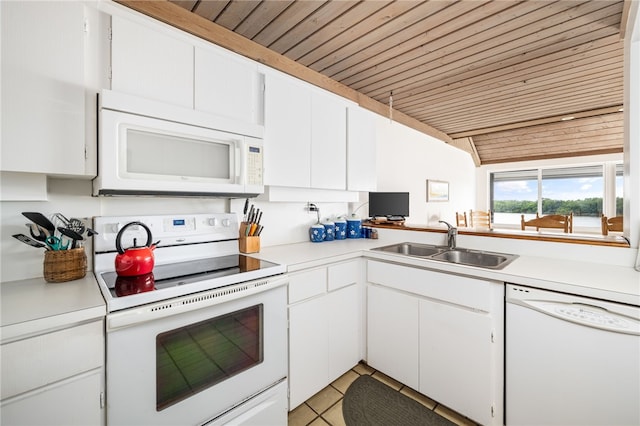 kitchen featuring white cabinetry, white appliances, sink, and light tile patterned floors