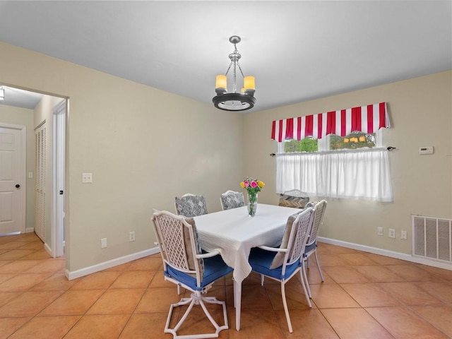 2237 10th Ave, Vero Beach, FL 32960 - dining room with visible vents, baseboards, a notable chandelier, and light tile patterned floors