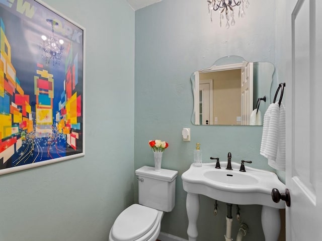2237 10th Ave, Vero Beach, FL 32960 - half bath with toilet and a chandelier