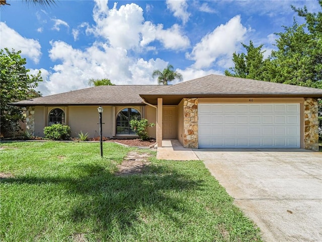 ranch-style house featuring a garage and a front yard