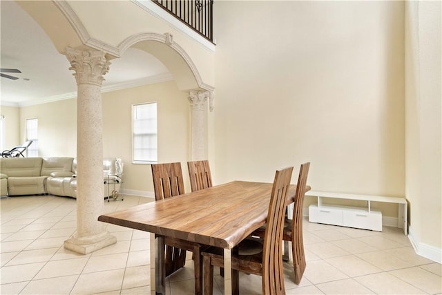 6139 57th Ct, Vero Beach, FL 32967 - dining area with decorative columns, light tile patterned floors, crown molding, and baseboards