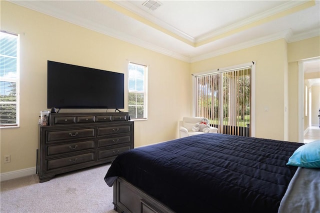 6139 57th Ct, Vero Beach, FL 32967 - bedroom featuring crown molding, a tray ceiling, light colored carpet, access to outside, and baseboards