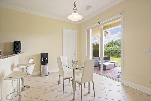 6139 57th Ct, Vero Beach, FL 32967 - dining room featuring light tile patterned floors, ornamental molding, and baseboards