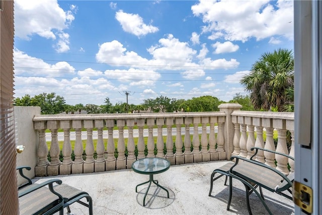 6139 57th Ct, Vero Beach, FL 32967 - view of patio with a balcony