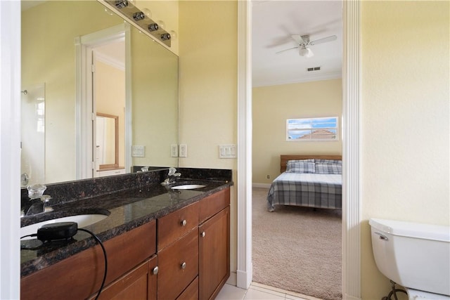 6139 57th Ct, Vero Beach, FL 32967 - full bath with a ceiling fan, toilet, crown molding, and double vanity
