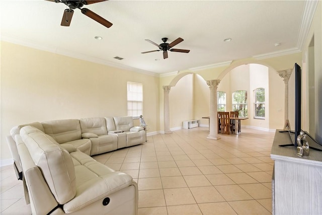 6139 57th Ct, Vero Beach, FL 32967 - living area with arched walkways, a ceiling fan, decorative columns, light tile patterned floors, and crown molding