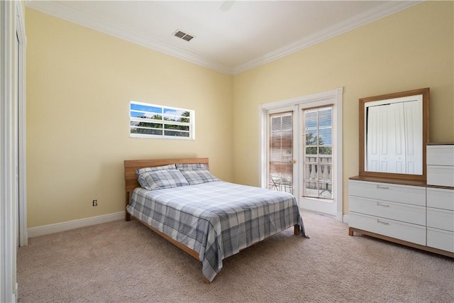 6139 57th Ct, Vero Beach, FL 32967 - bedroom with access to outside, ornamental molding, carpet floors, and baseboards
