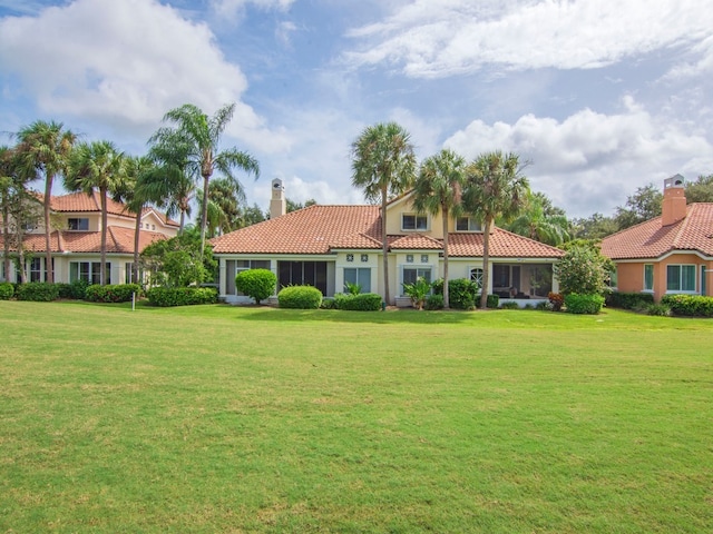 view of front of property with a front lawn