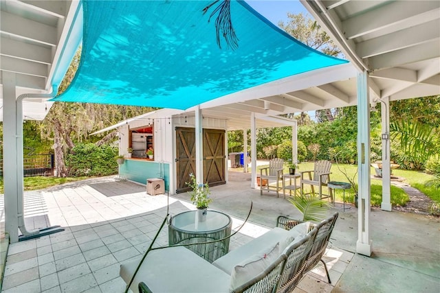 811 Royal Palm Pl, Vero Beach, FL 32960 - view of patio / terrace featuring an outbuilding and an outdoor hangout area