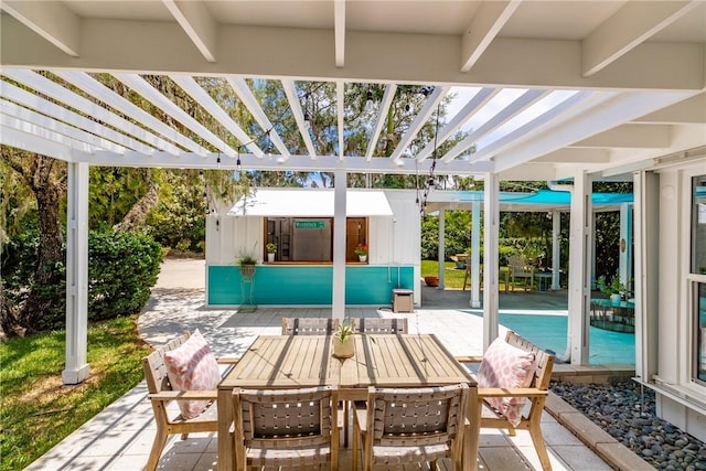 811 Royal Palm Pl, Vero Beach, FL 32960 - view of patio / terrace with a pergola, an outbuilding, and outdoor dining area