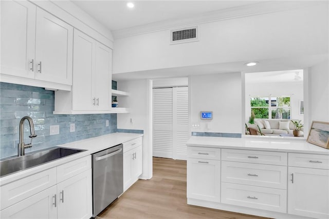 811 Royal Palm Pl, Vero Beach, FL 32960 - kitchen with dishwasher, light countertops, white cabinetry, open shelves, and recessed lighting