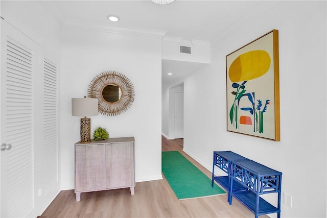 811 Royal Palm Pl, Vero Beach, FL 32960 - hall featuring wood finished floors and ornamental molding