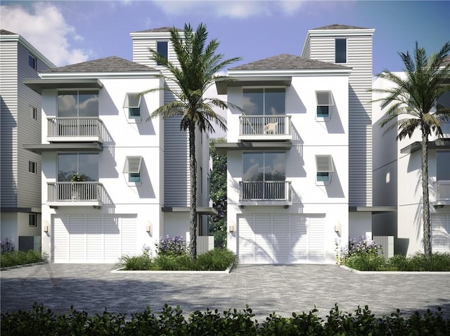 805 46th Pl Unit 11, Vero Beach, FL 32963 - view of apartment building / complex featuring decorative driveway and a garage