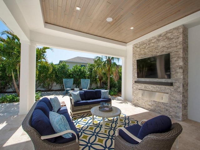 909 Surfsedge Way, Vero Beach, FL 32963 - view of patio / terrace featuring an outdoor living space with a fireplace