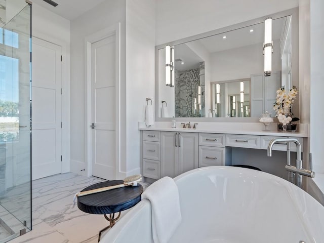 909 Surfsedge Way, Vero Beach, FL 32963 - bathroom featuring a shower stall, a soaking tub, marble finish floors, vanity, and recessed lighting