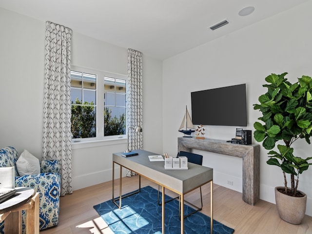 office area with hardwood / wood-style floors