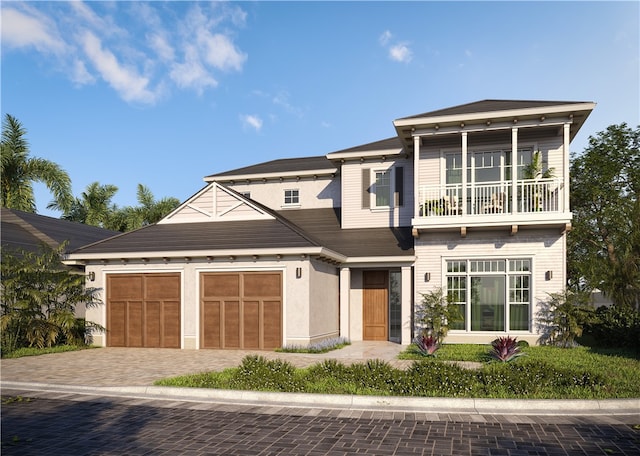 view of front facade with a garage and a balcony