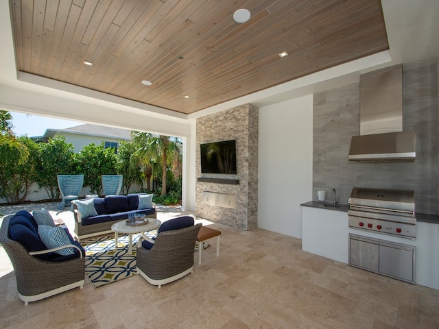 view of patio featuring outdoor lounge area, a grill, exterior kitchen, and sink